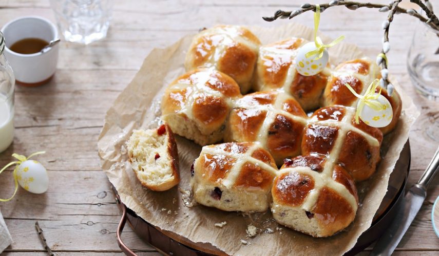 homemade hot cross buns on a baking tray