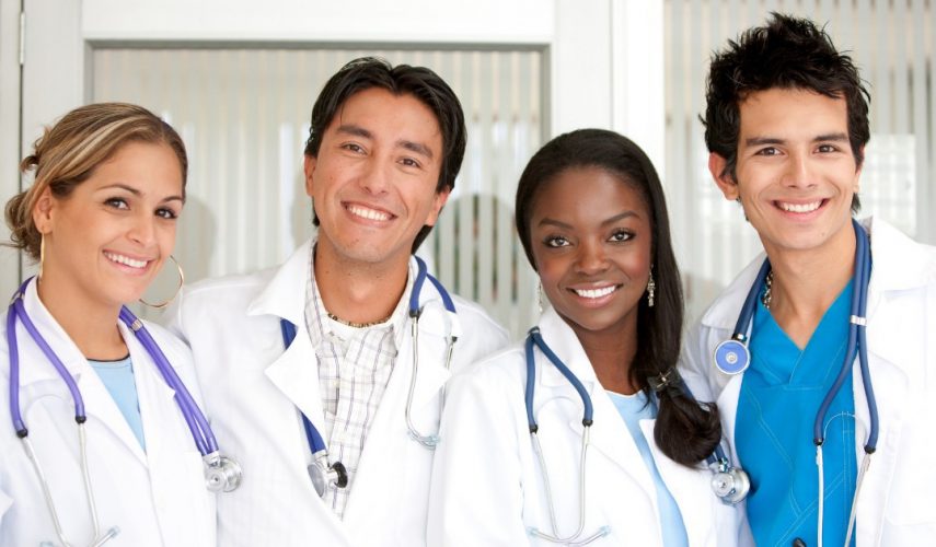 smiling nurses and doctors in a health clinic