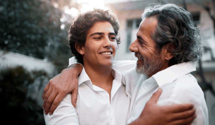 son and father hugging each other on fathers day