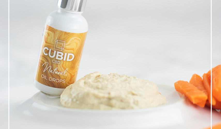 hummus in a bowl with CBD oil drops