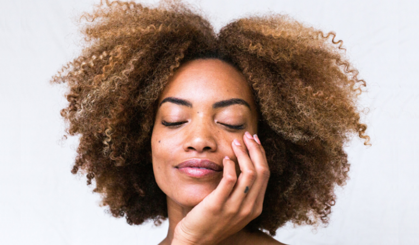 happy black women with beautiful glowing skin