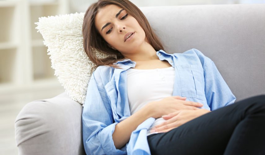 Young woman with abdominal, endometriosis pain.